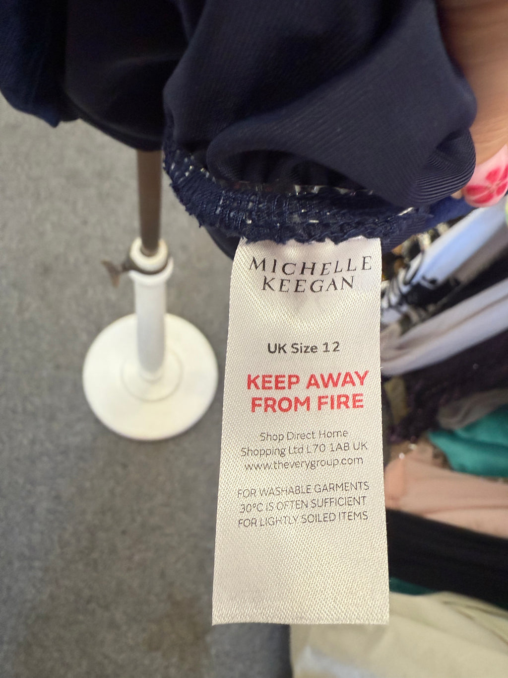 Michelle Keegan navy velor high neck long sleeved dress