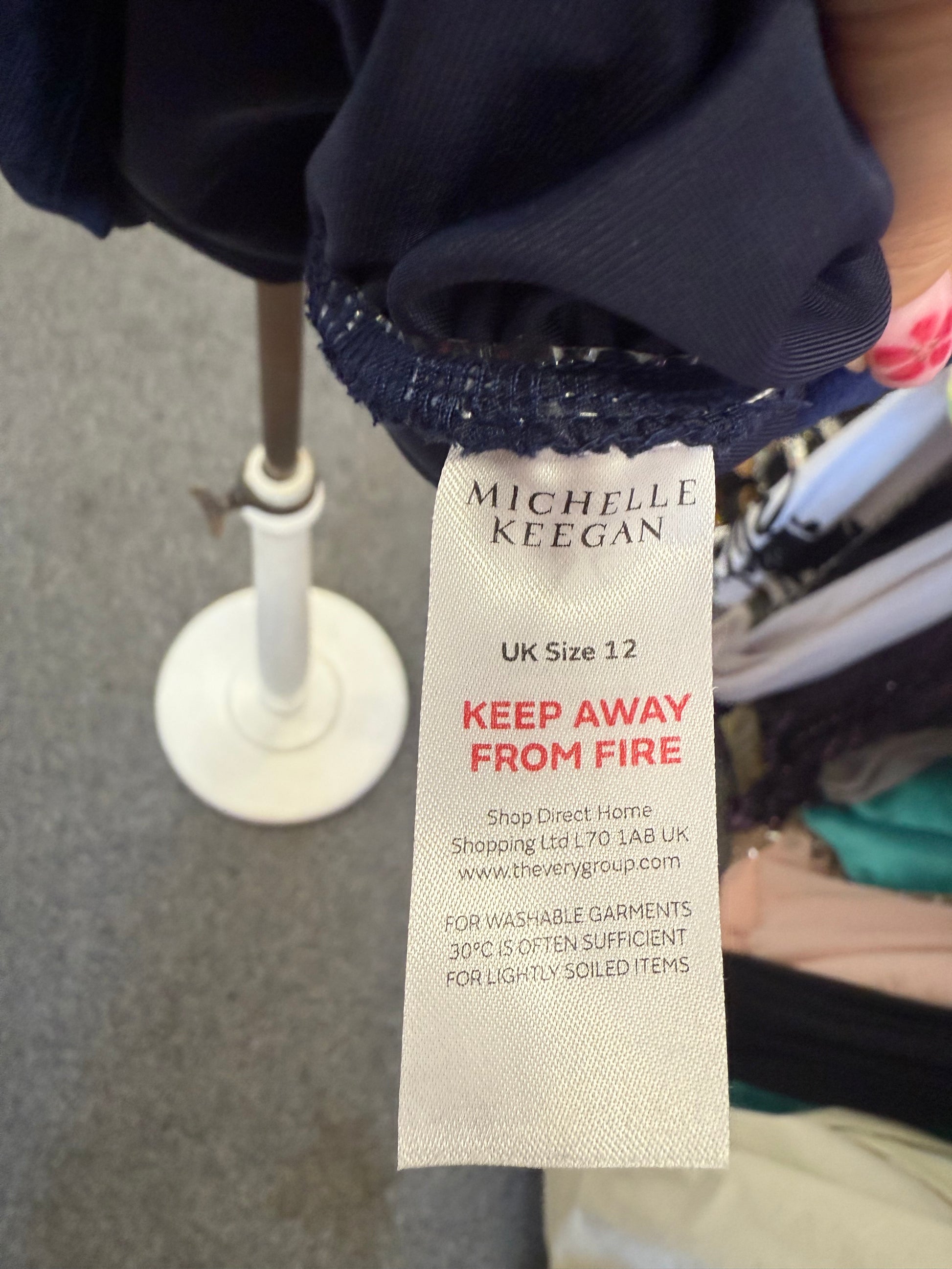 Michelle Keegan navy velor high neck long sleeved dress